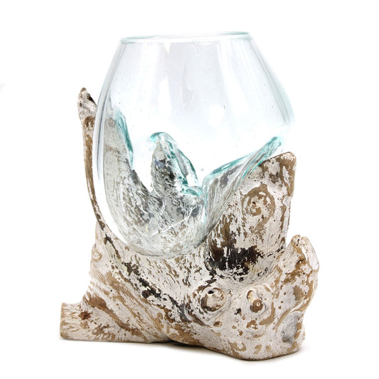 A medium hand-blown glass bowl resting perfectly on the natural contours of a piece of reclaimed root wood with a distressed whitewashed finish.