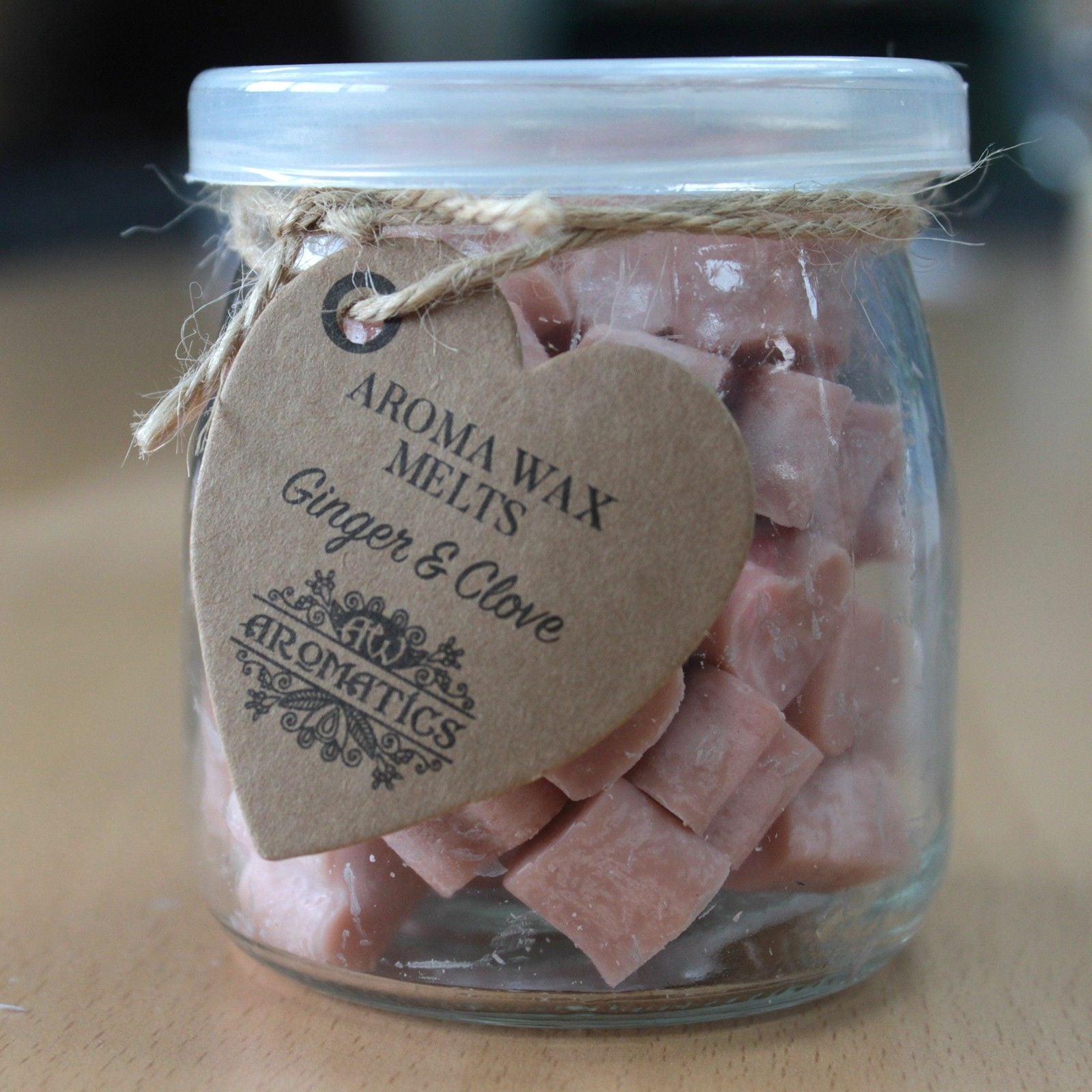 Ginger & Clove soy wax heart melts in a glass jar with rustic kraft tag.