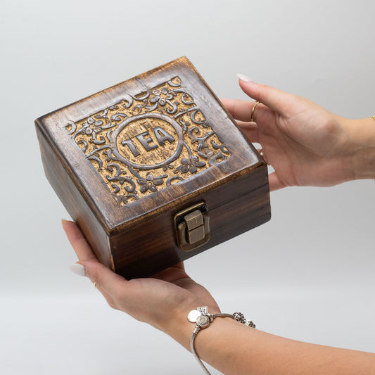 Hand-carved mango wood tea box with four compartments and an antiqued brass clasp.
