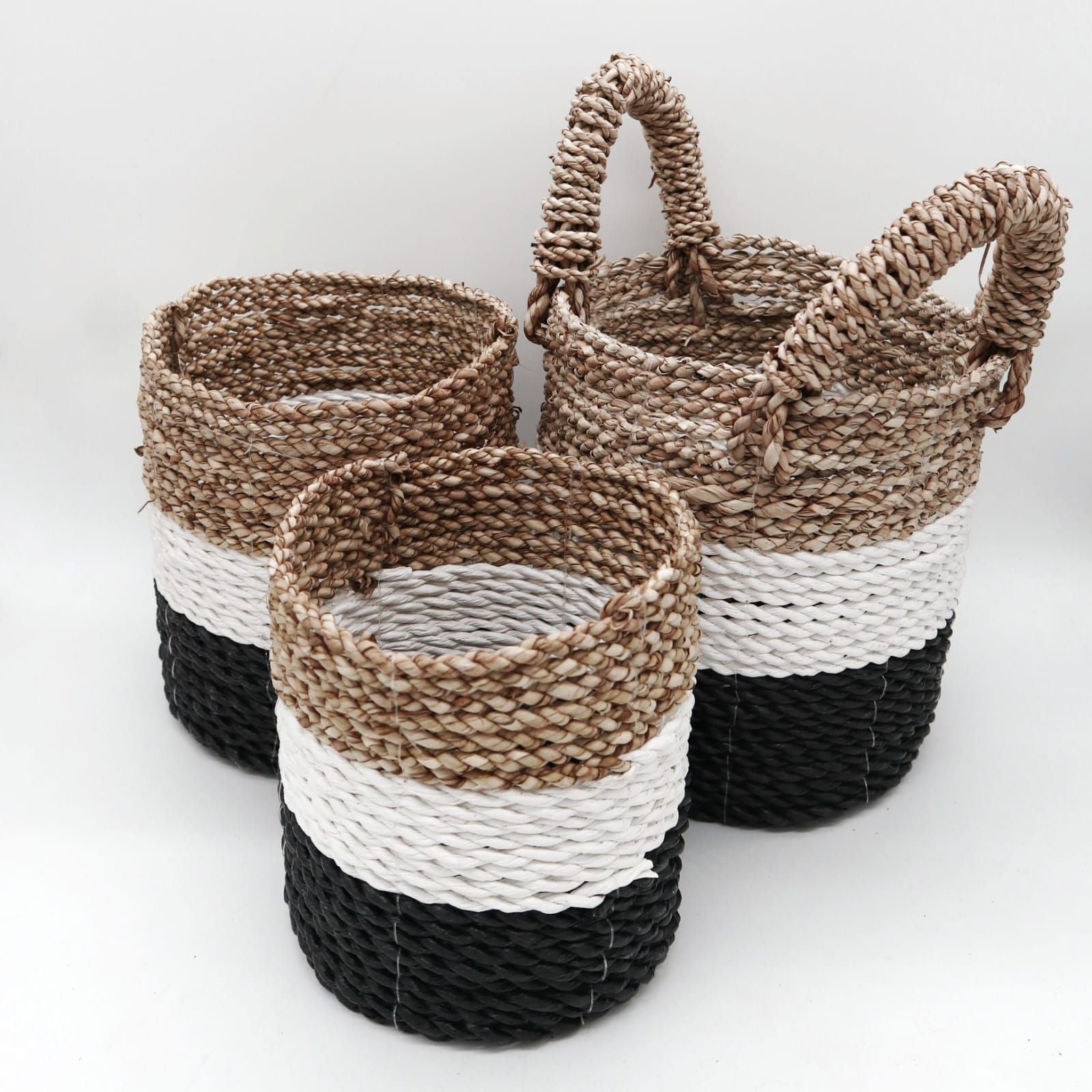 Tri-tone hand-woven natural seagrass basket set for sustainable home storage and decor.