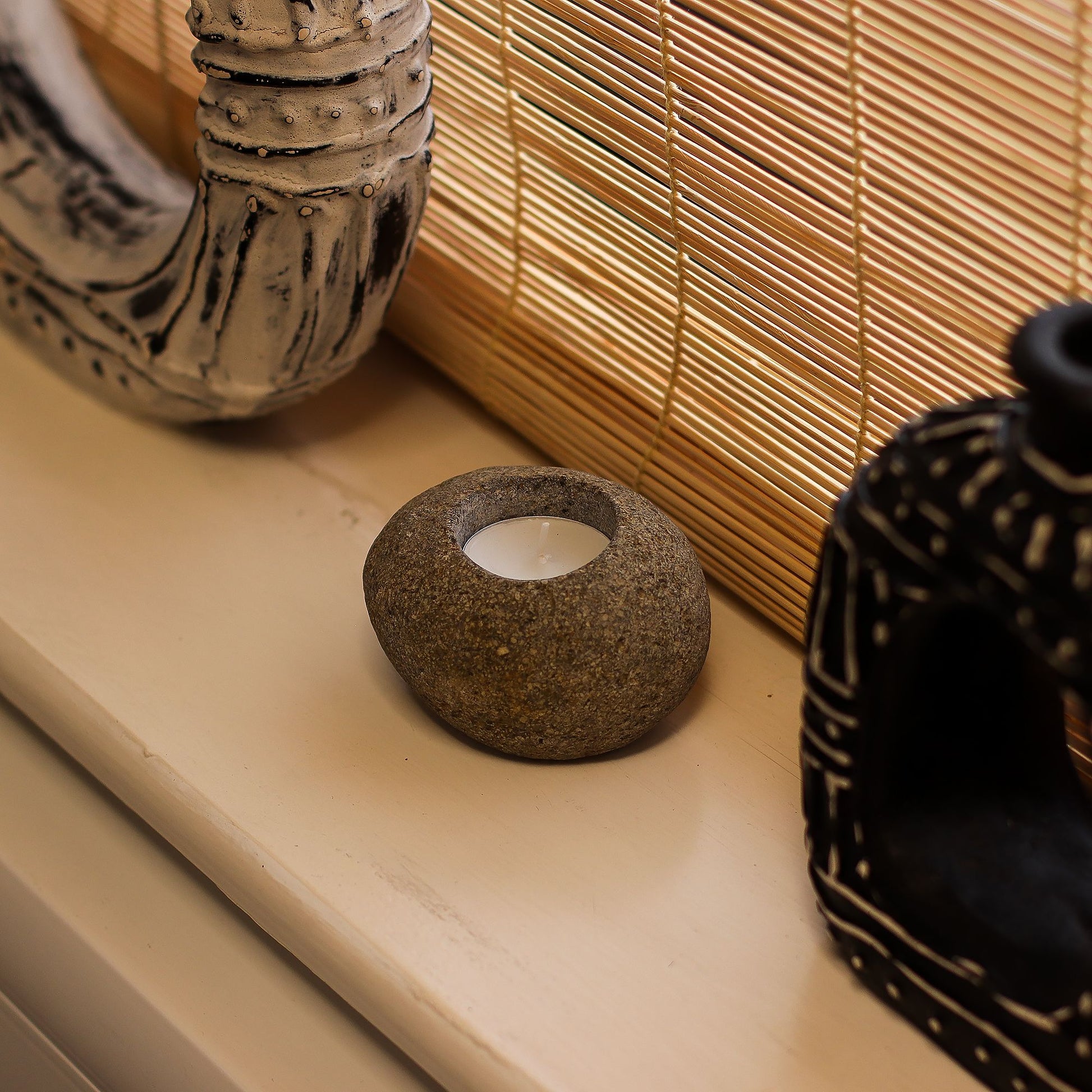 Single tealight holder carved from genuine, hand-finished Indonesian river stone.