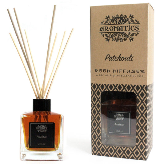 Earthy Patchouli essential oil reed diffuser in glass bottle with rattan sticks for home fragrance.