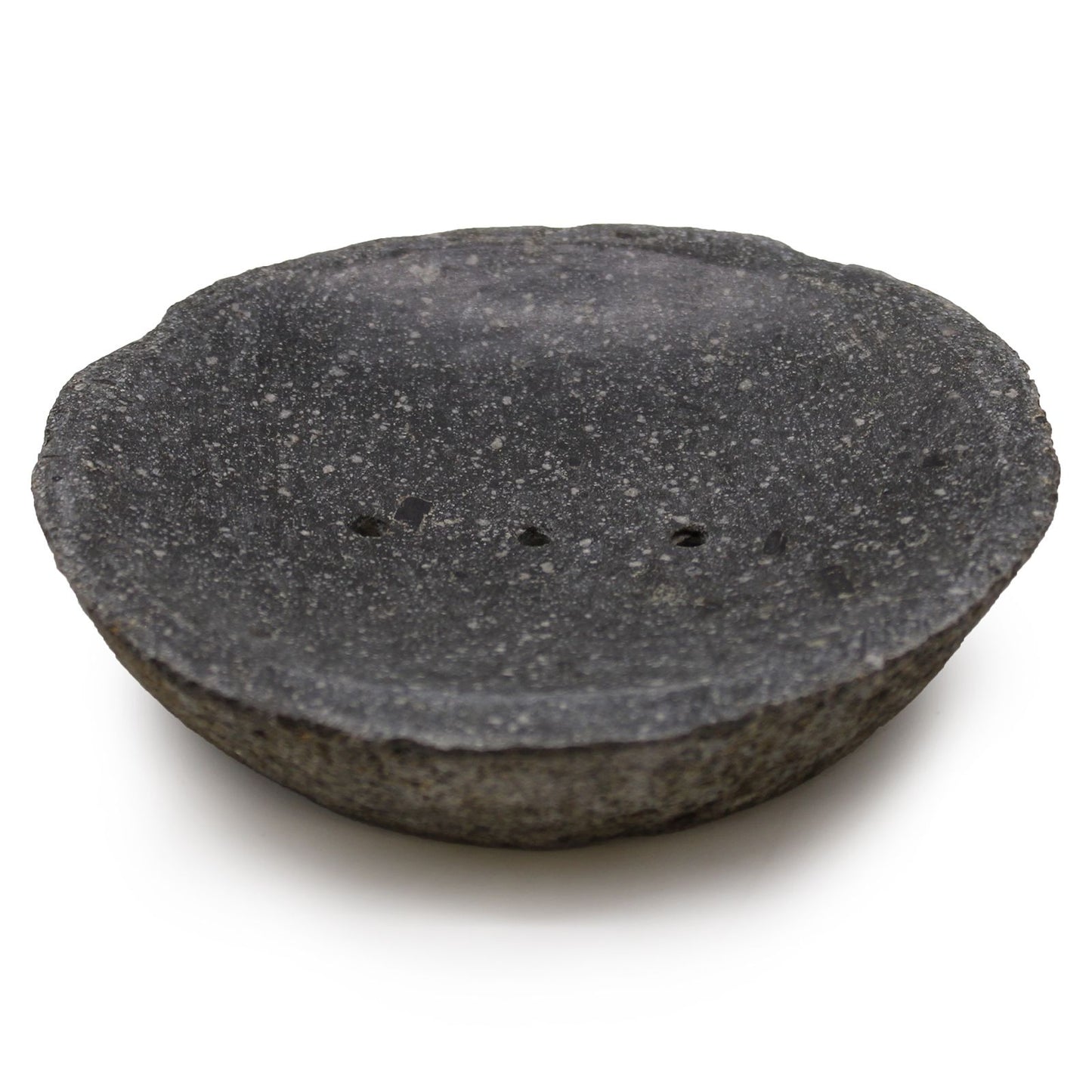 Dark grey handcrafted natural riverstone soap dish with raw edges and drainage holes for artisan soap