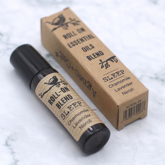Sleep Essential Oil Pulse Point Roller in an amber glass bottle with kraft packaging.