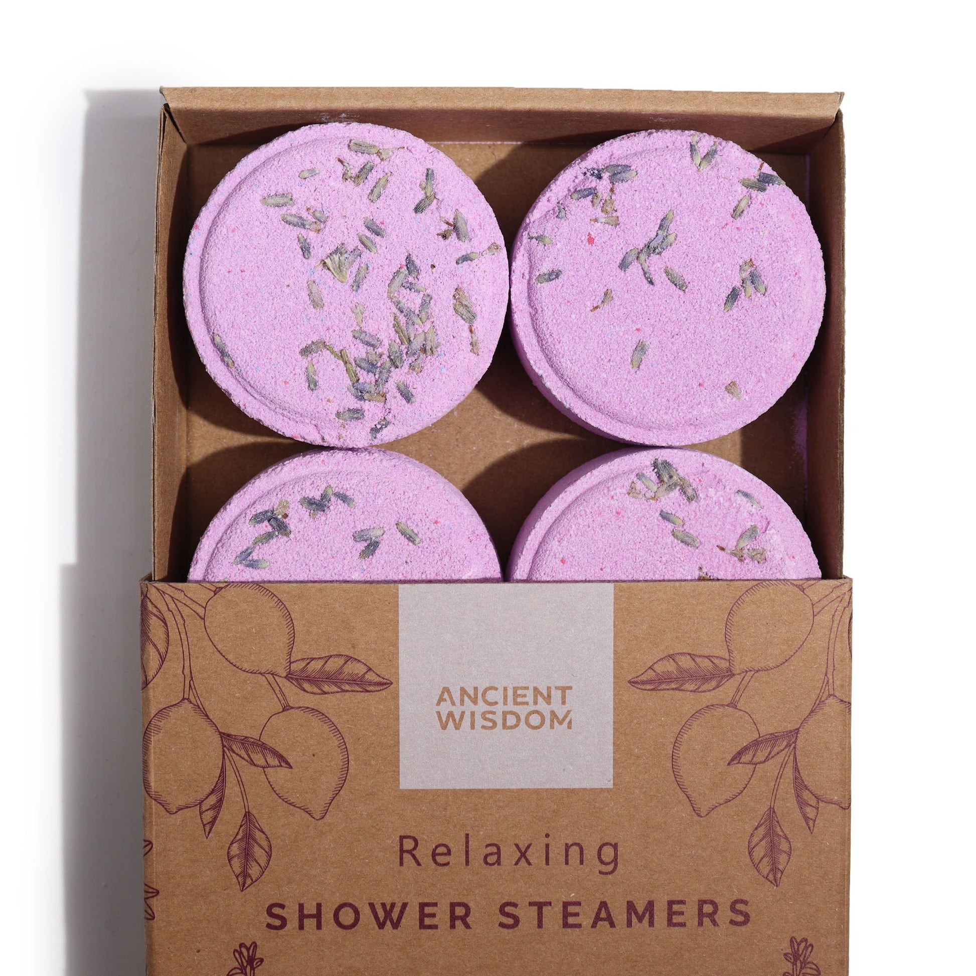 Set of four Relaxing Botanical Shower Steamers topped with lavender seeds in a kraft gift box.