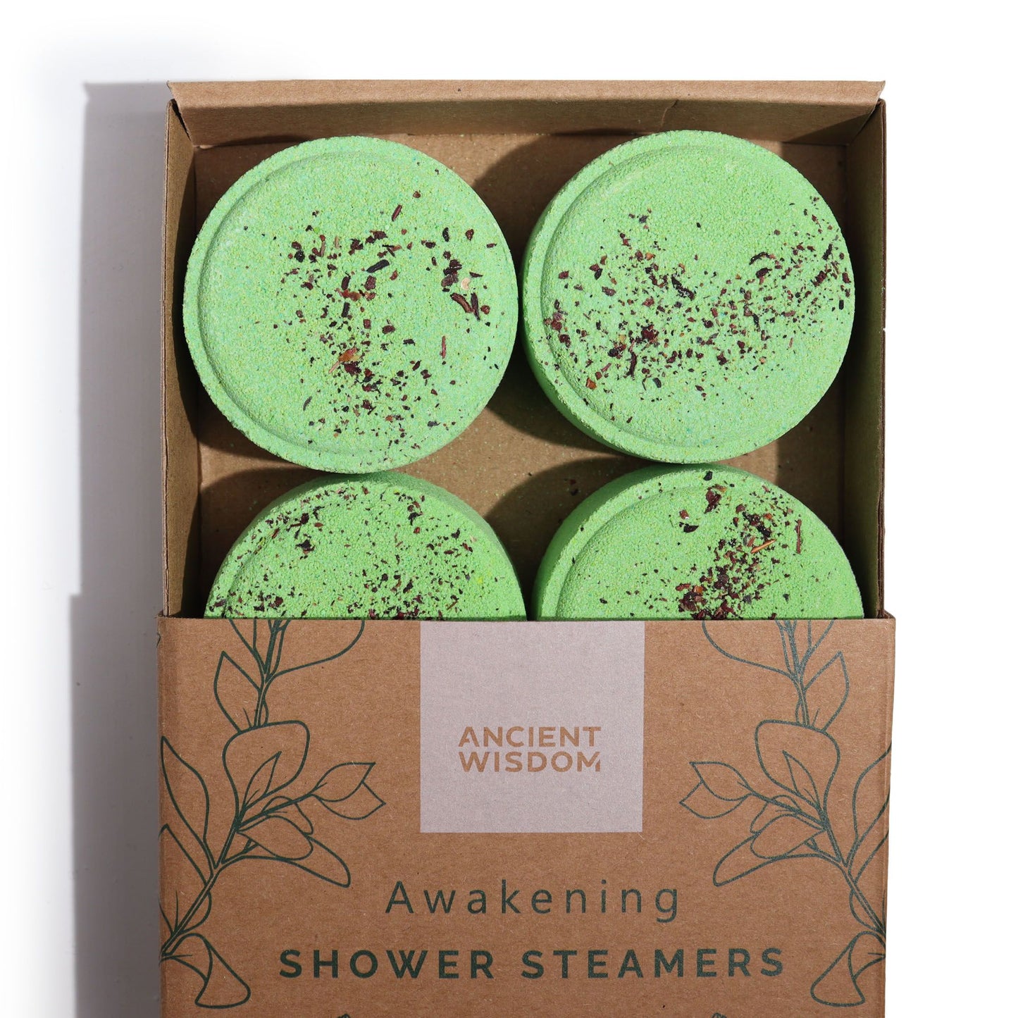 Set of four Awakening Botanical Shower Steamers topped with crushed herbs in a kraft gift box.