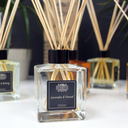 Artisan Lavender & Fennel essential oil reed diffuser in glass bottle with rattan sticks.
