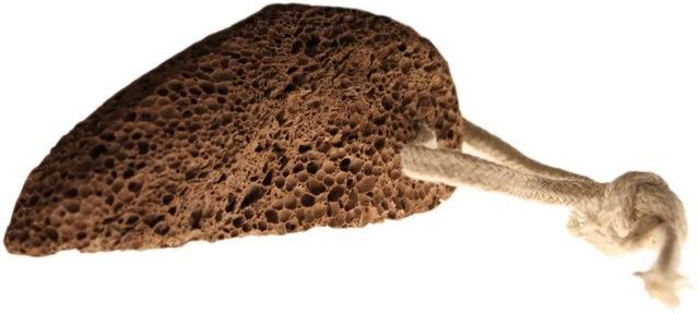 Natural volcanic lava foot stone with a rustic rope loop for sustainable, effective exfoliation.