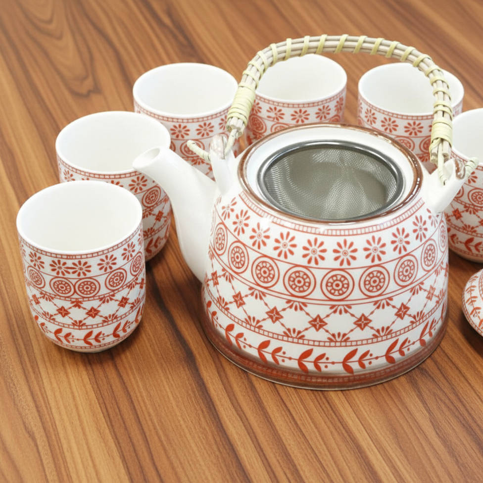 Amber ceramic teapot and tasting cup set featuring a geometric pattern and woven handle.
